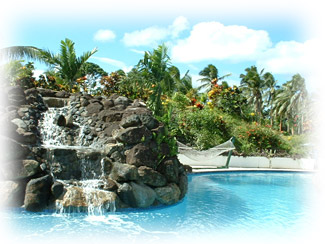 The pool at Lomalagi with waterfall and hammocks